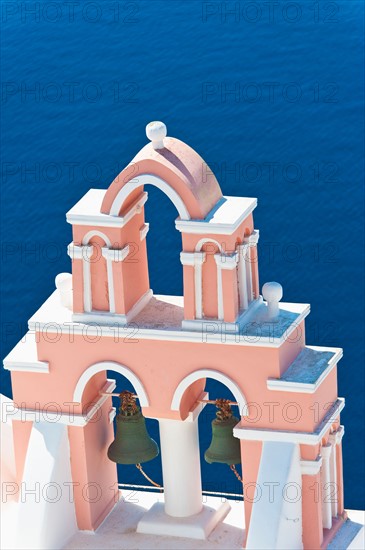 Greece, Cyclades Islands, Santorini, Oia, Church bell tower by sea.