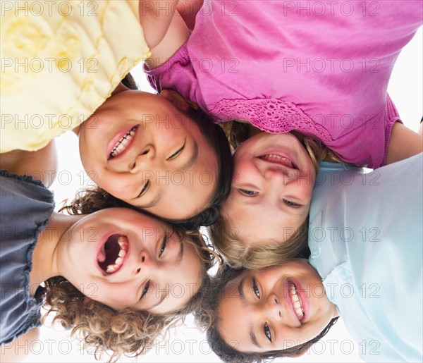 Portrait of girls (6-9) in huddle.