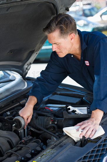 Mechanic repairing car.