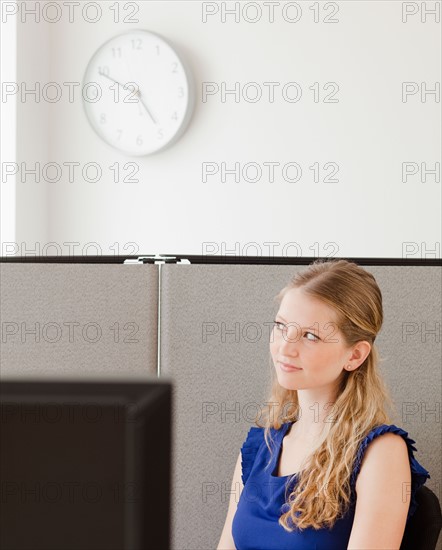 Portrait of young woman in office. Photo : Jamie Grill