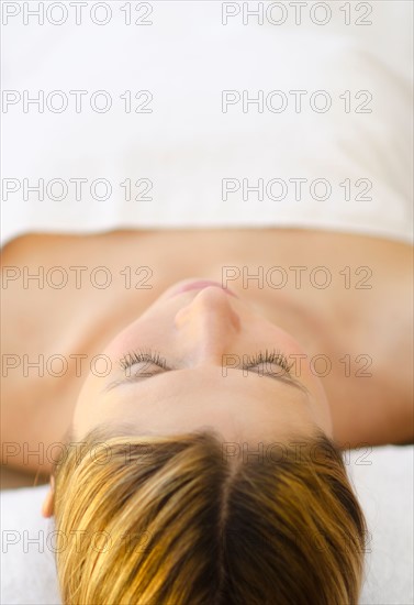 Woman relaxing at health spa.