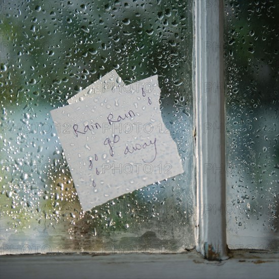 Close up of message on wet window in rainy day. Photo : Jamie Grill