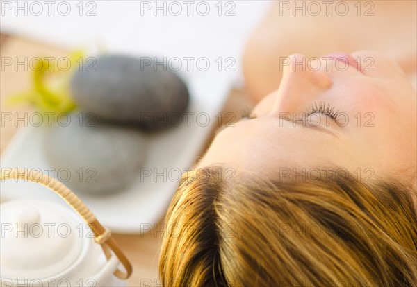 Woman relaxing at health spa.