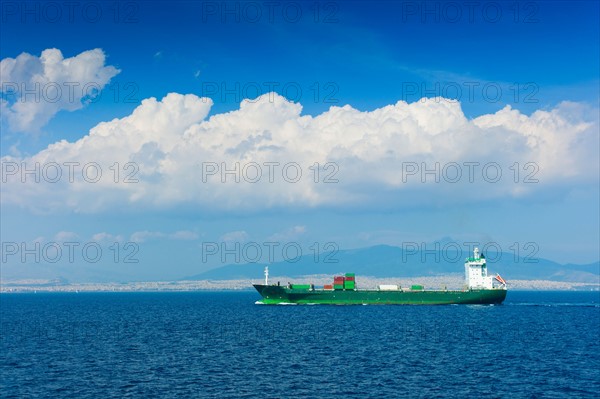 Greece, Container ship on Aegean Sea.