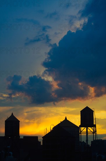 USA, New York City, silhouettes of buildings at sunset.