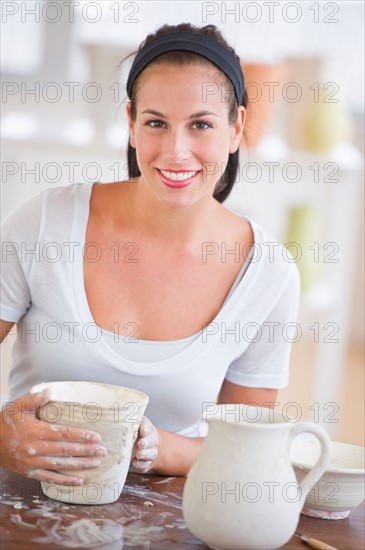 Woman making pottery.