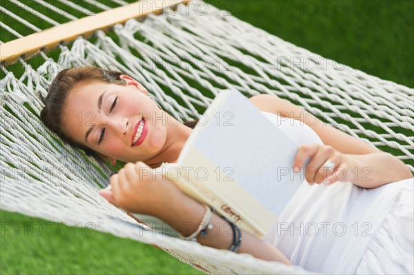 Woman relaxing in hammock.