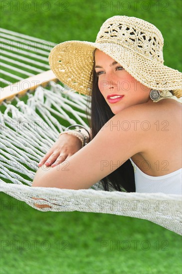 Woman relaxing in hammock.