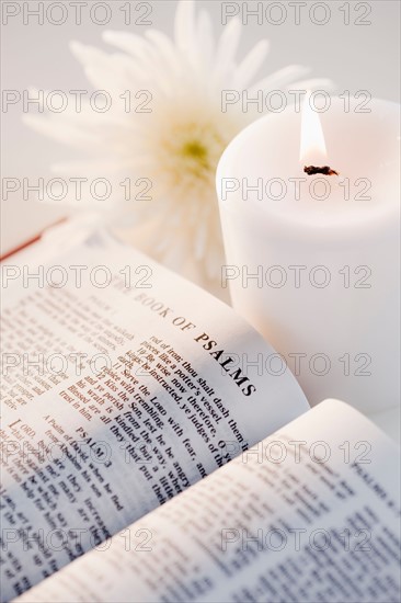 Bible, aster and candle. Photo : Jamie Grill