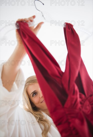 Woman holding dress. Photo: Jamie Grill