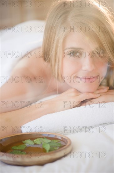 Portrait of woman relaxing in spa. Photo: Jamie Grill