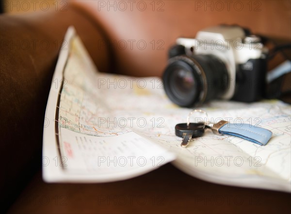 Close up of map, camera and car keys. Photo : Jamie Grill