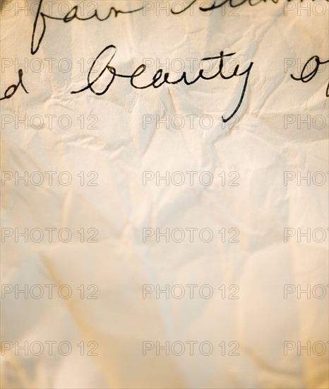 Close up of antique love letter on parchment . Photo : Jamie Grill