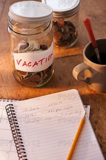 Close up of jar with money for vacations. Photo : Daniel Grill