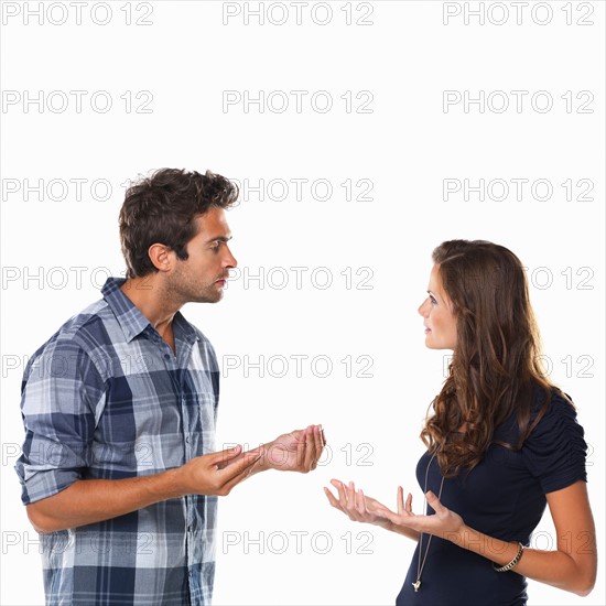 Studio shot of young couple arguing. Photo : momentimages