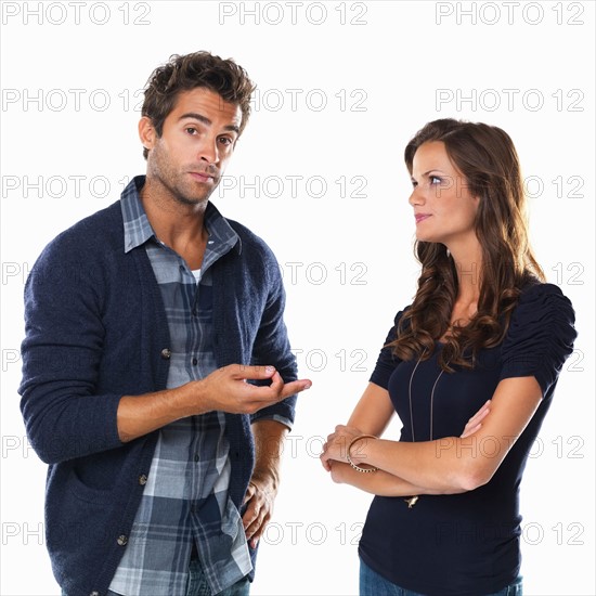 Studio shot of young couple looking upset. Photo: momentimages