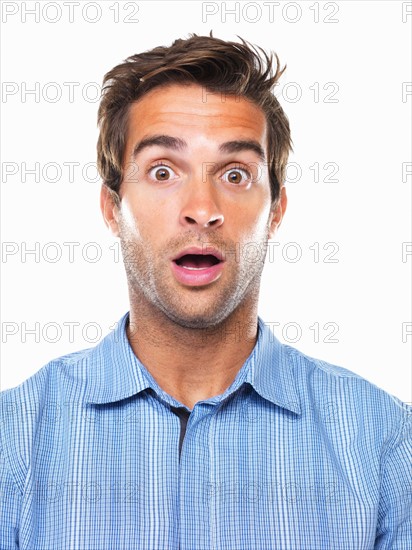 Studio portrait of shocked business man. Photo : momentimages