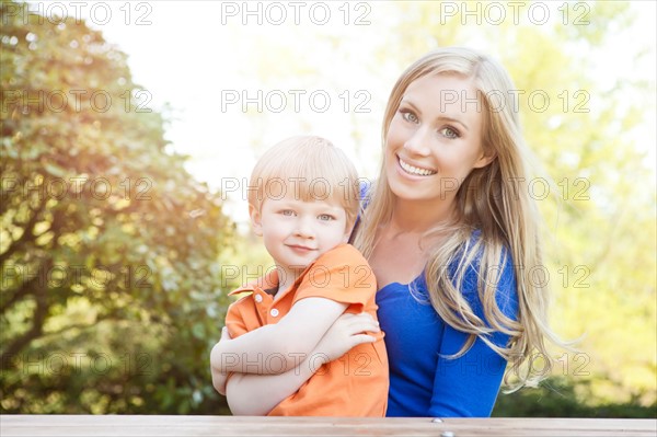 Portrait of mother and son (2-3) in park. Photo: Take A Pix Media