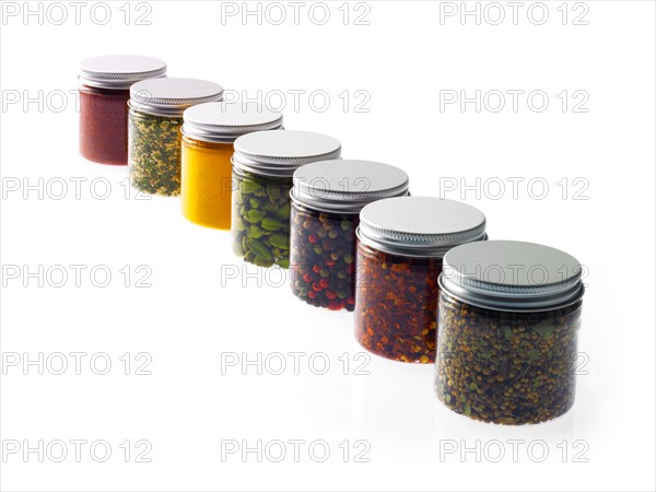 Studio shot of row of jars with spices. Photo : David Arky