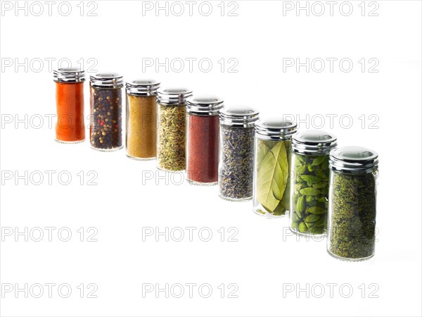 Studio shot of row of jars with spices. Photo : David Arky