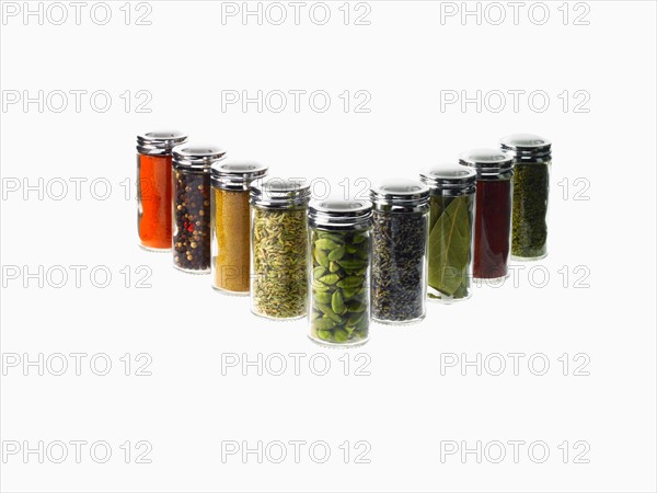 Studio shot of row of jars with spices. Photo : David Arky