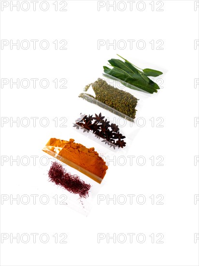 Studio shot of row of packets with spices. Photo : David Arky