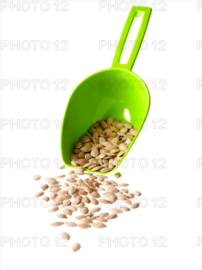 Studio shot of scoop with Mixed Seeds on white background. Photo : David Arky