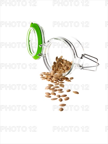 Studio shot of jar with Pumpkin Seeds on white background. Photo: David Arky