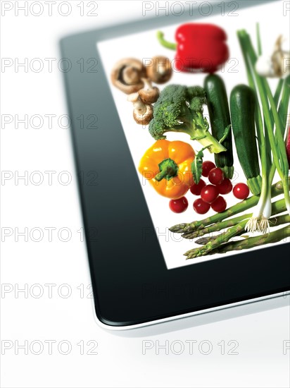 Studio shot of various vegetables on digital tablet. Photo : David Arky