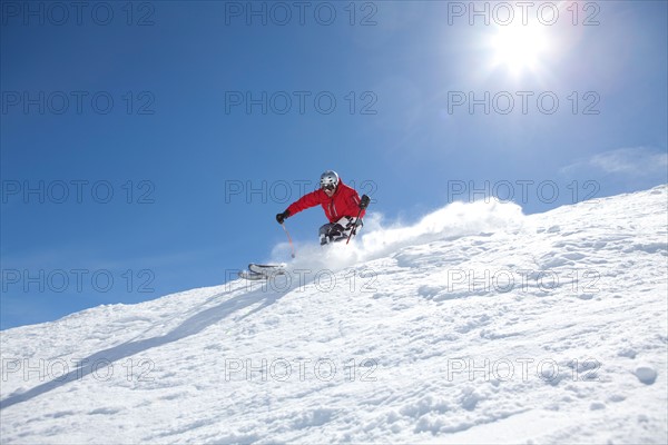 Male skier on fresh powder snow