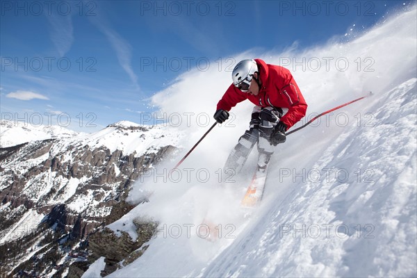 Male skier on fresh powder snow