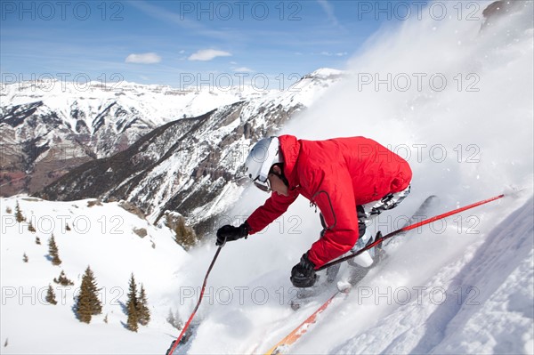 Male skier on fresh powder snow