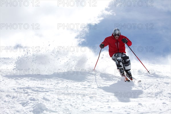 Male skier on fresh powder snow