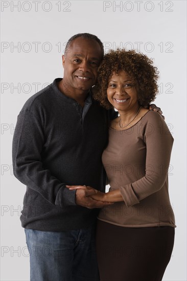 Portrait of mature couple, studio shot. Photo : Rob Lewine