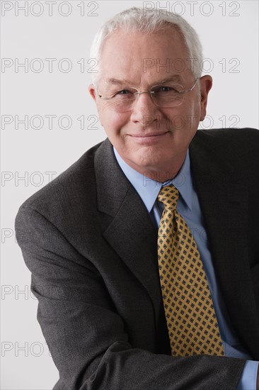 Portrait of senior businessman, studio shot. Photo : Rob Lewine