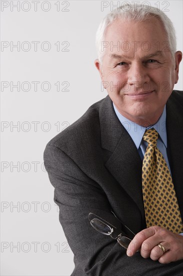 Portrait of senior businessman, studio shot. Photo: Rob Lewine