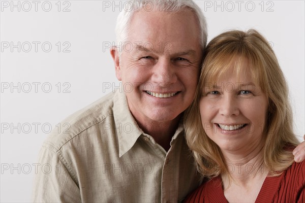 Portrait of elderly couple, studio shot. Photo : Rob Lewine