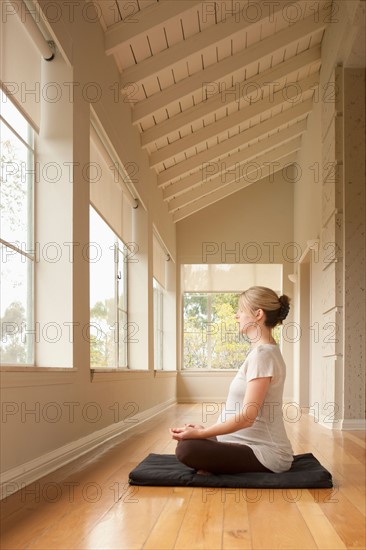 Pregnant woman practicing yoga. Photo : Rob Lewine