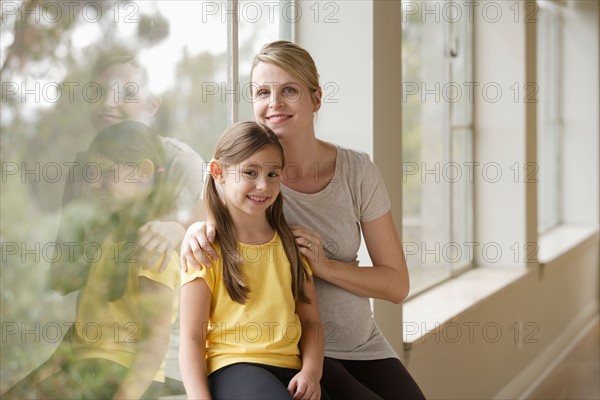 Pregnant woman with daughter (6-7). Photo : Rob Lewine