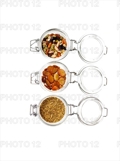 Studio shot of jars with Mixed Seeds on white background. Photo : David Arky