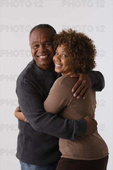 Portrait of mature couple, studio shot. Photo : Rob Lewine