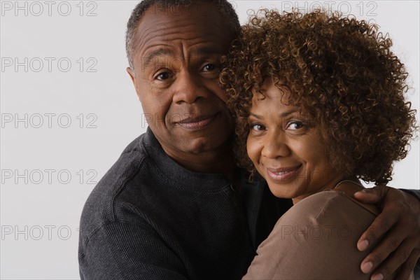 Portrait of mature couple, studio shot. Photo: Rob Lewine