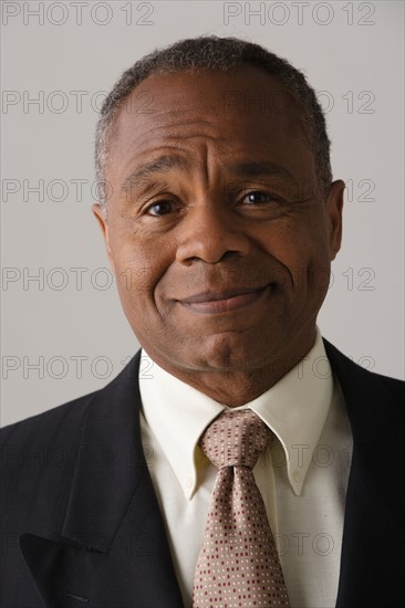 Portrait of mature businessman, studio shot. Photo : Rob Lewine