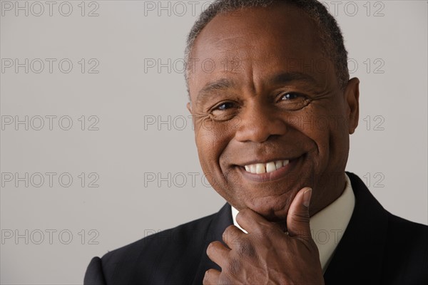 Portrait of mature businessman, studio shot. Photo: Rob Lewine