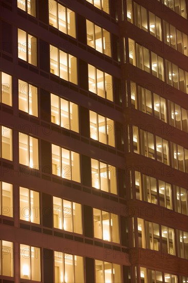USA, New York State, New York City, Contemporary office building illuminated at night. Photo : fotog