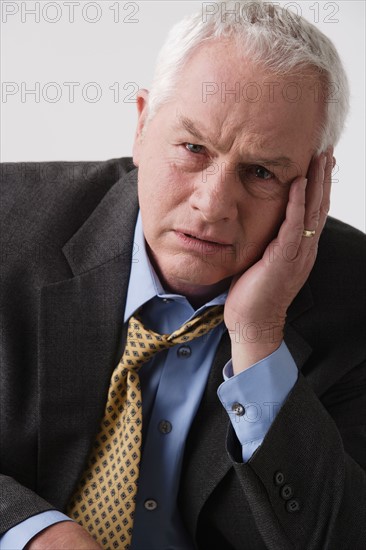 Portrait of senior businessman, studio shot. Photo : Rob Lewine