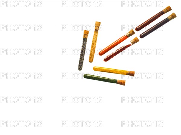 Studio shot of Test Tubes making Arrow shape on white background. Photo : David Arky