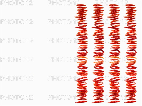 Studio shot of Red Chili Peppers on white background. Photo: David Arky