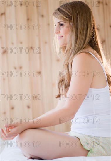 Woman practicing yoga in spa. Photo : Jamie Grill