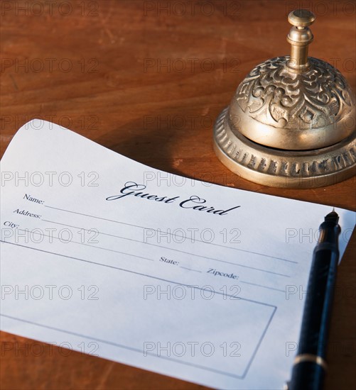 Close up of antique guest card and service bell. Photo : Daniel Grill